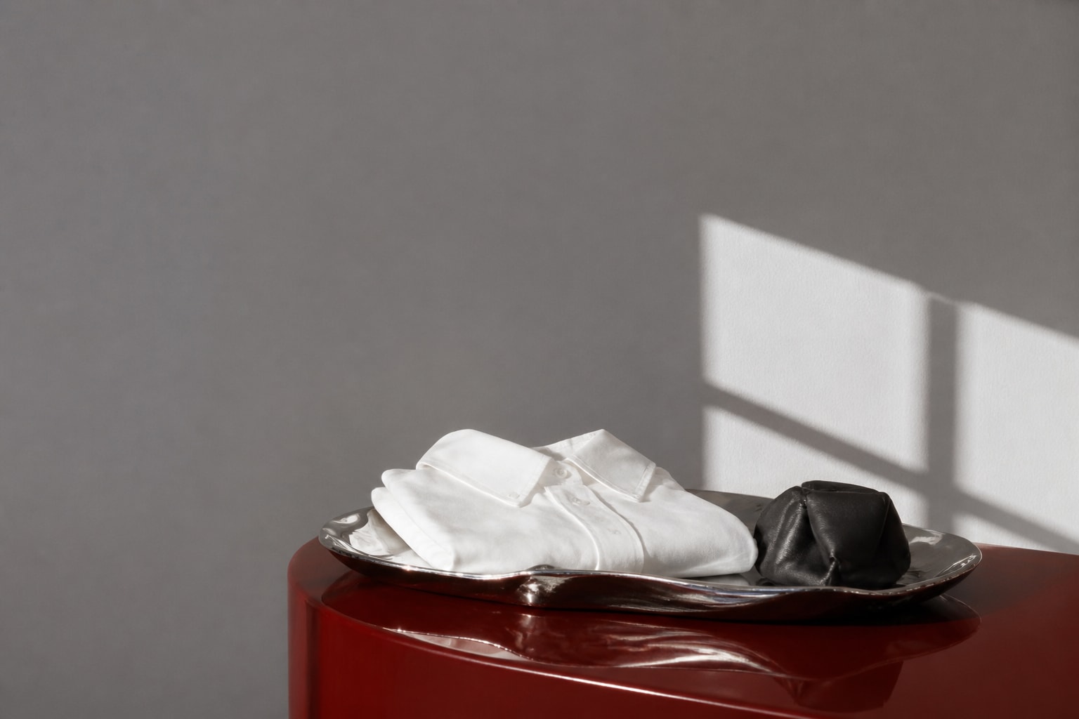 Chrome, cotton and leather in architectural sunlight